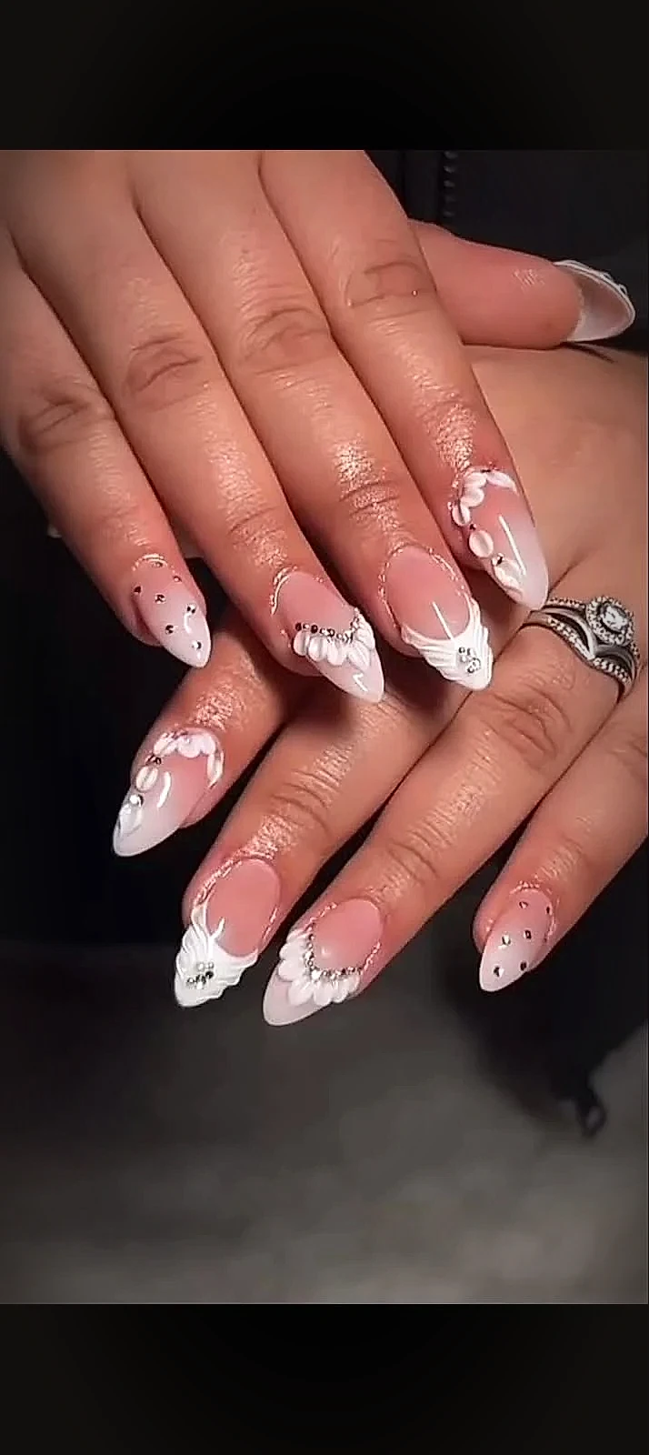 Sculpted 3D acrylic flower petals with pearl borders and crystal studs on almond nails